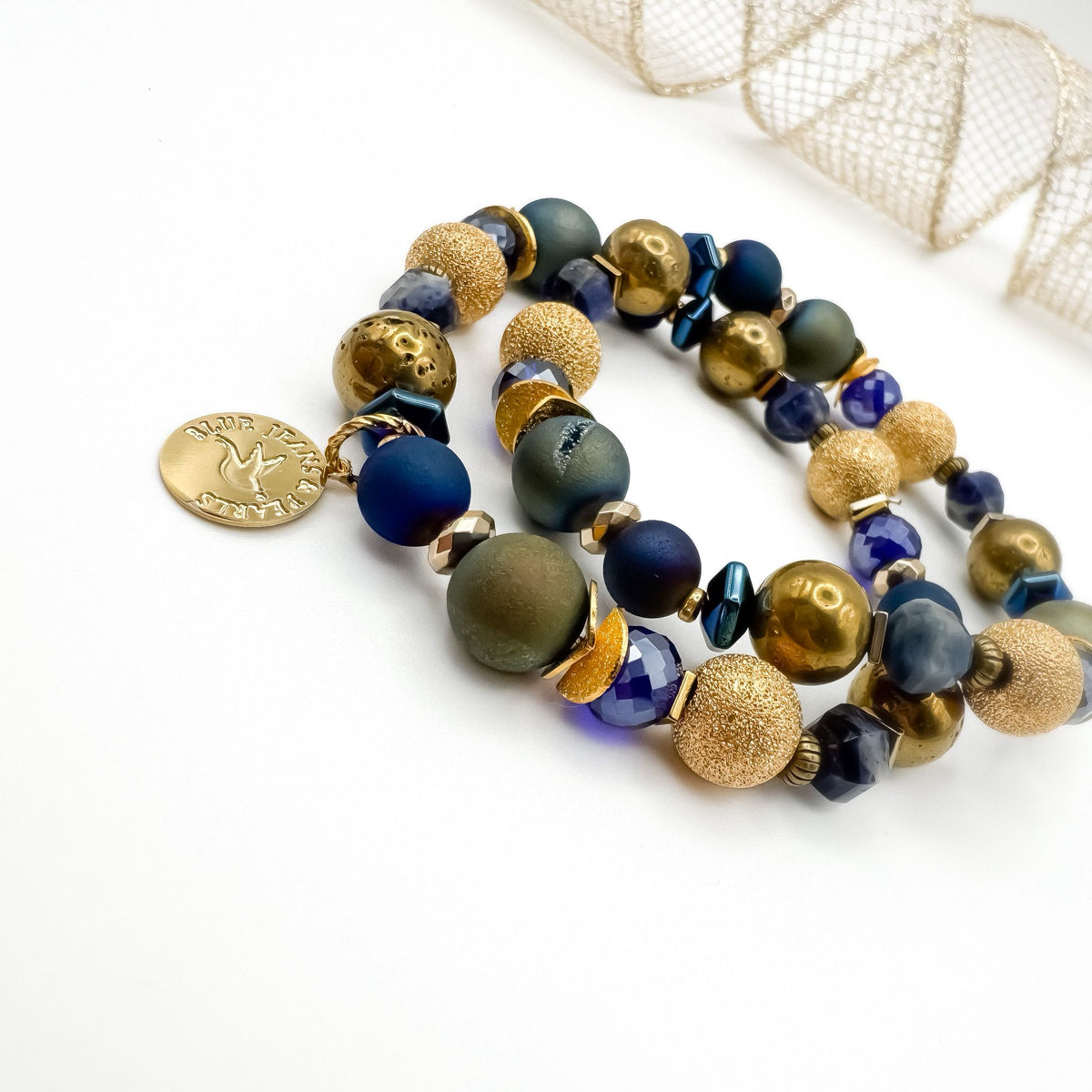 Between Stars handmade one of a kind faceted sodalite, geode druzy and electroplated hematite bracelet stack with gold Blue Jeans and Pearls charm styled with gold mesh ribbon, night sky inspired gemstone jewelry Saskatchewan