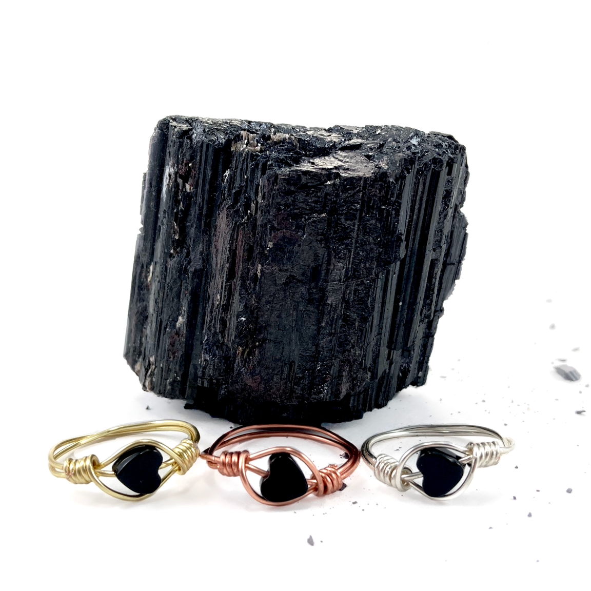 Black heart shaped obsidian rings featuring wire filled plated wire in gold rose gold or silver - hand wrapped