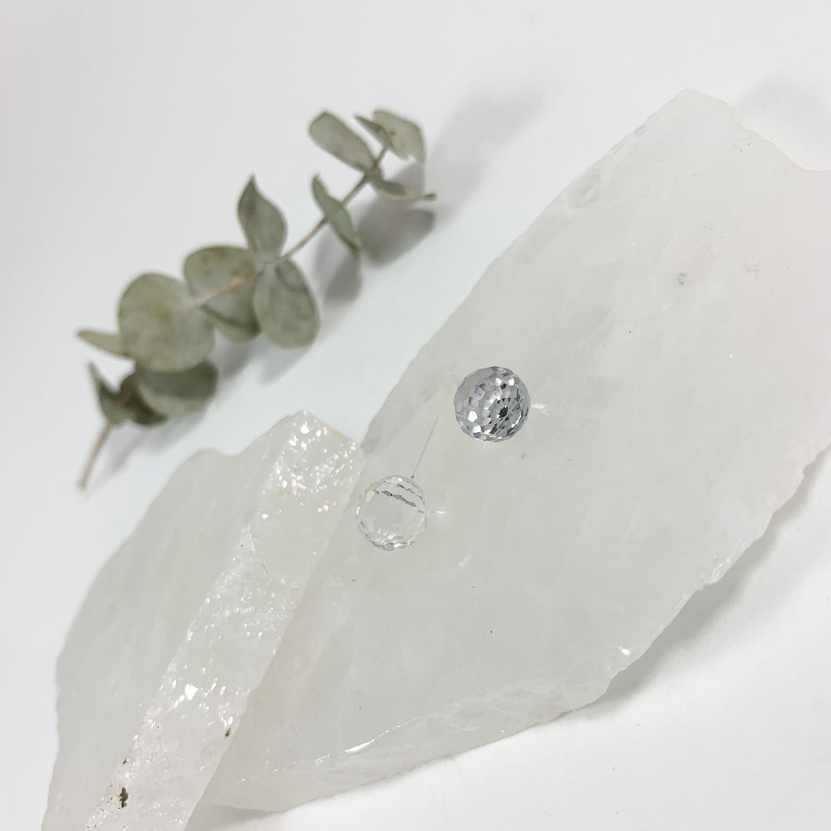 Crystal Clear disco stud earrings with 8mm faceted transparent Austrian crystal and visible clear plastic post on raw white crystal with eucalyptus, hypoallergenic stud earrings for sensitive ears by Blue Jeans and Pearls Saskatchewan