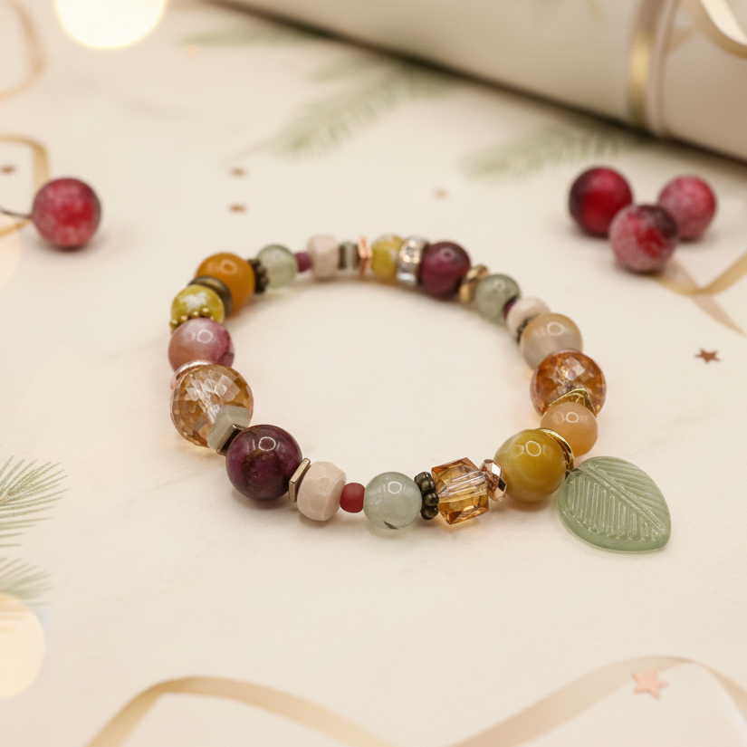 Prairie Sunsets Fuchsia and Firelight one of a kind handmade bracelet featuring prehnite, fire agate, serpentine and hematite with glass leaf charm styled with cranberries and pine, unique gemstone jewelry by Blue Jeans and Pearls Saskatchewan