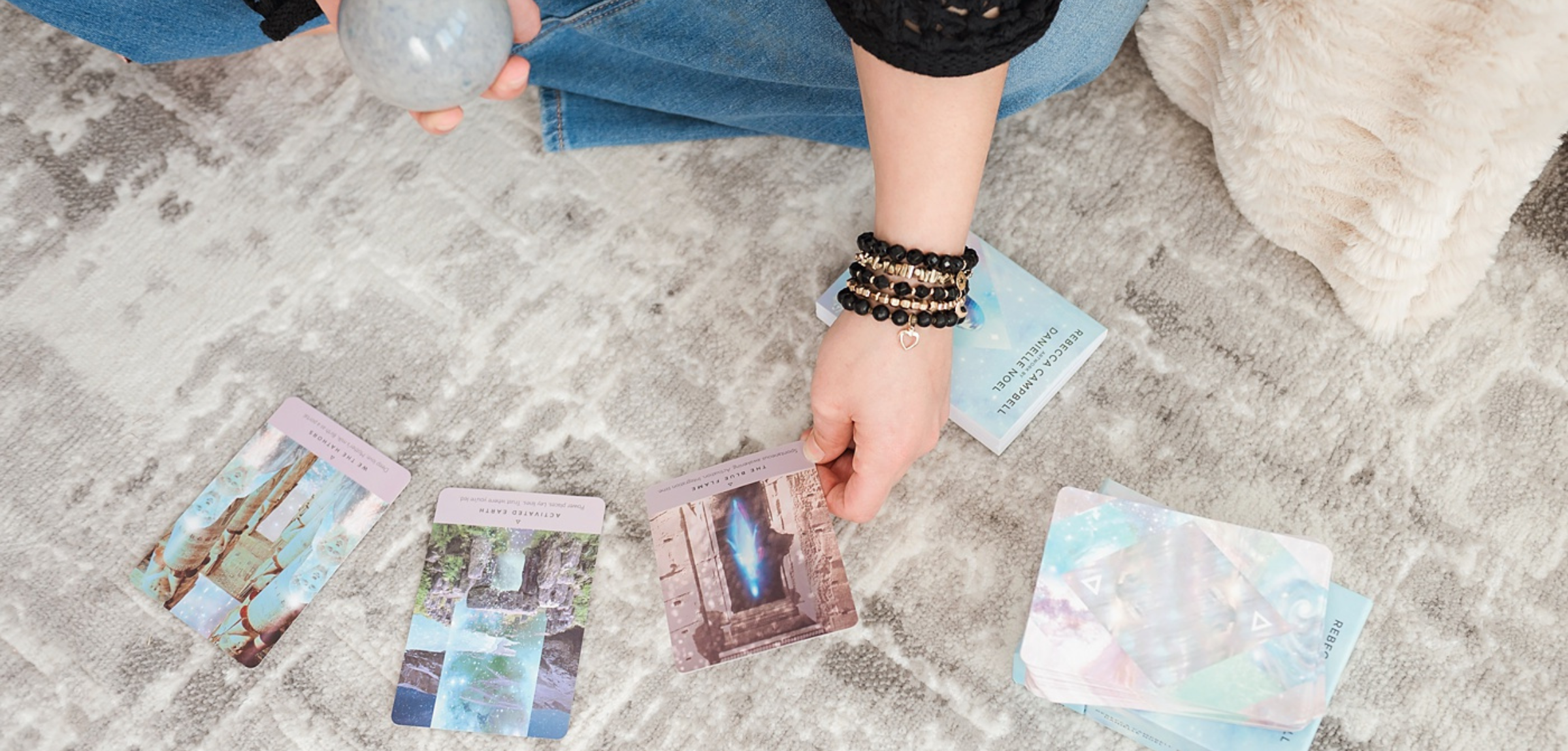 Woman wearing handmade gemstone bracelet stack designed by Blue Jeans and Pearls, Regina SK jeweler