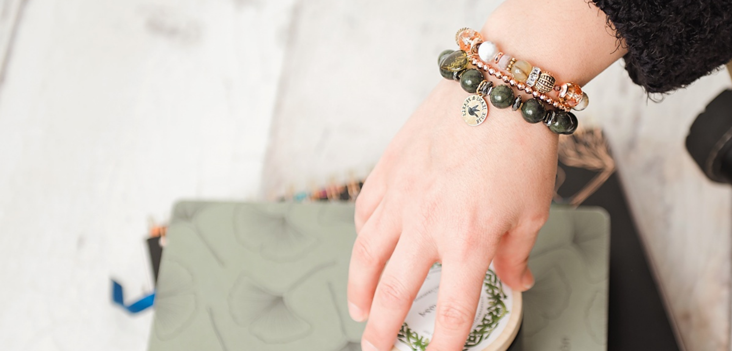 Woman wearing handmade gemstone bracelet and earrings by Blue Jeans and Pearls, Regina SK jeweler"