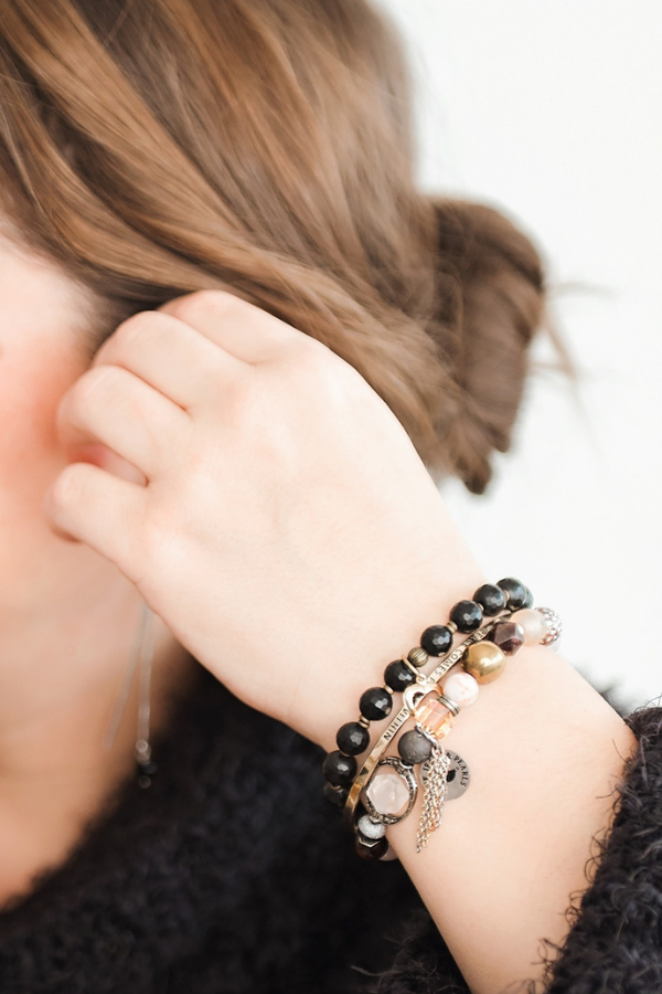 Woman wearing handmade gemstone bracelets by Blue Jeans and Pearls, Regina SK jeweler