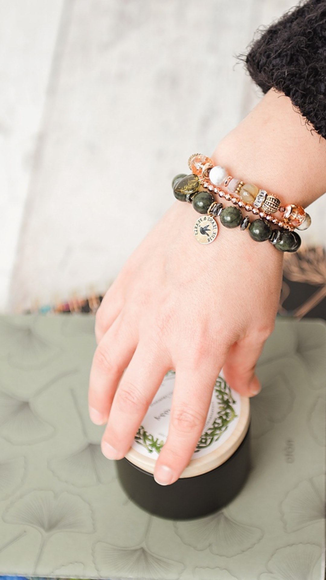 Woman wearing handmade gemstone bracelet and earrings by Blue Jeans and Pearls, Regina SK jeweler"
