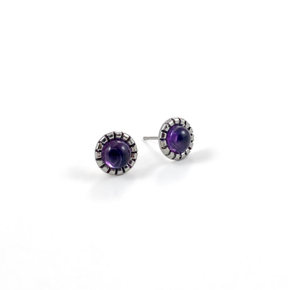 Amethyst stud earrings with 9mm round purple amethyst cabochons in scalloped stainless steel bezel settings on white background, natural gemstone stud earrings for sensitive ears by Blue Jeans and Pearls Saskatchewan