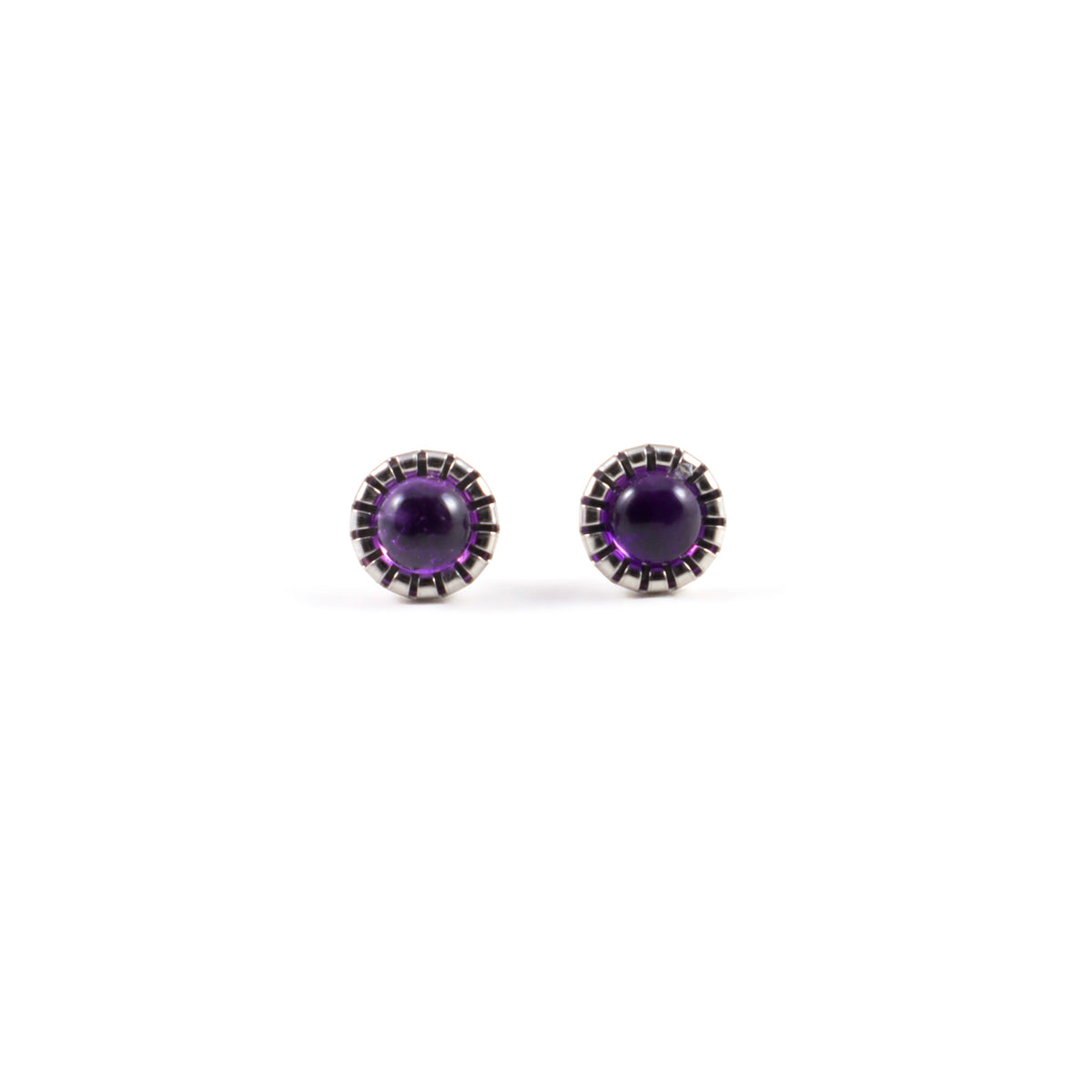 Amethyst stud earrings front view with matching 9mm round purple amethyst cabochons in scalloped stainless steel bezel settings on white background, simple gemstone studs by Blue Jeans and Pearls Saskatchewan