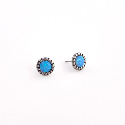 Light Blue Opal stud earrings with 6mm man-made opalite showing blue and green shimmer in scalloped stainless steel bezel settings on white background, sparkly stud earrings for sensitive ears by Blue Jeans and Pearls Saskatchewan