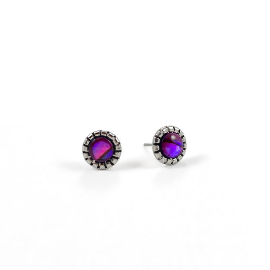 Paua Shell Magenta stud earrings pair showing shifting pink, purple and violet abalone shell colours in scalloped stainless steel bezels with posts visible, iridescent shell earrings for sensitive ears by Blue Jeans and Pearls Saskatchewan